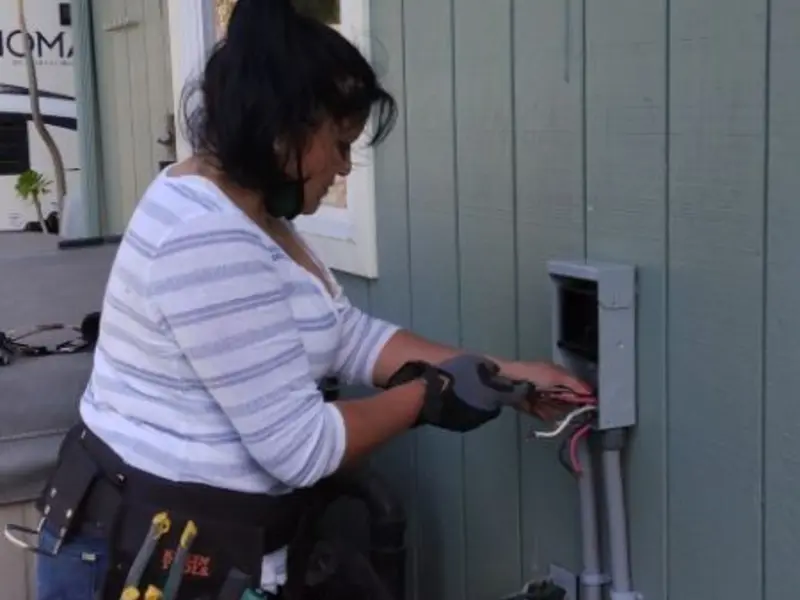 Licensed electrician wiring an exterior subpanel in Jurupa Valley